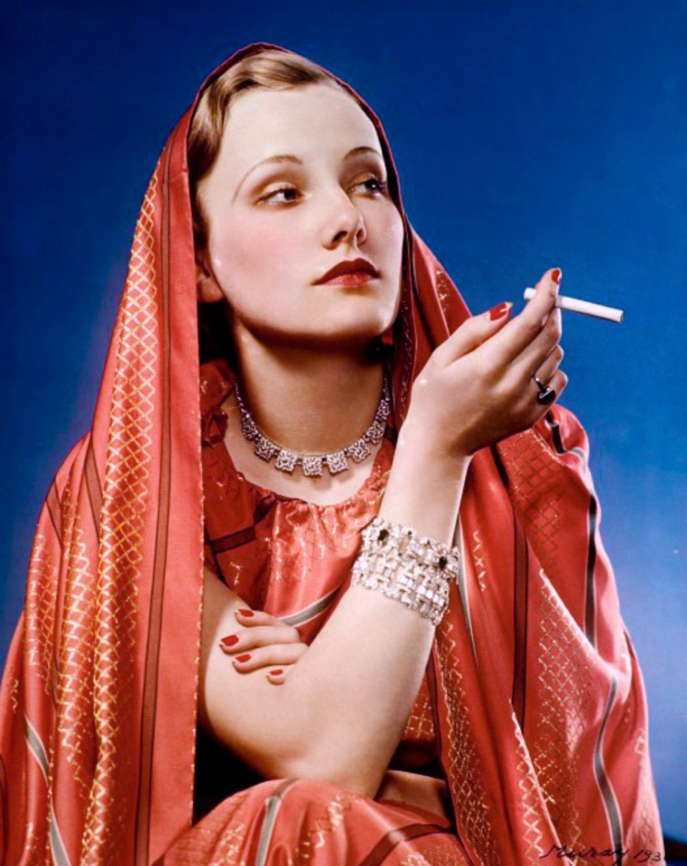 1936. Girl in Red advertisement for Lucky Strike; shot by Nickolas Muray, a photographer enlisted by Bernays to help popularize feminine thinness and cigarette smoking.jpg